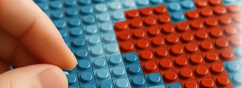Hand placing red LEGO brick on blue baseplate with Photobrick logo.